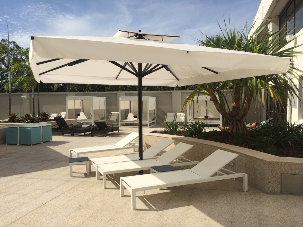 Casino hotel pool, Broadbeach, Queensland, Australia — Calma umbrella and una in place