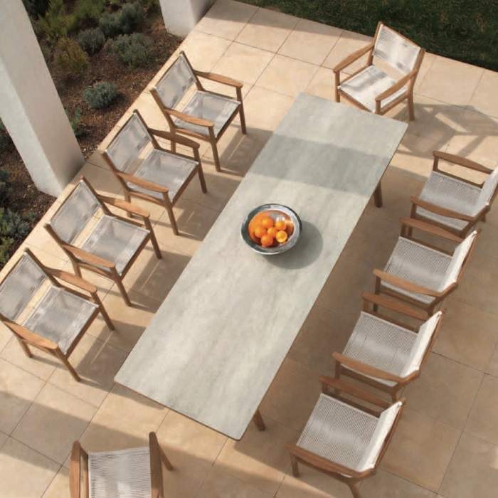 dining table with a round tabletop and cord-weave dining chairs viewed from directly above