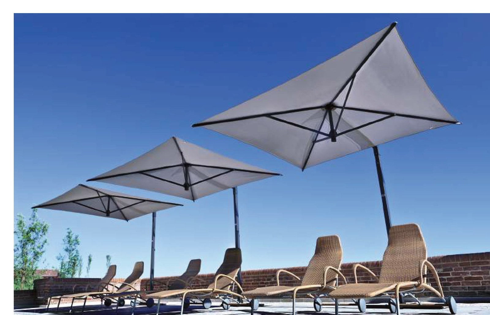 row of three square cantilever canopies shading loungers on a rooftop terrace